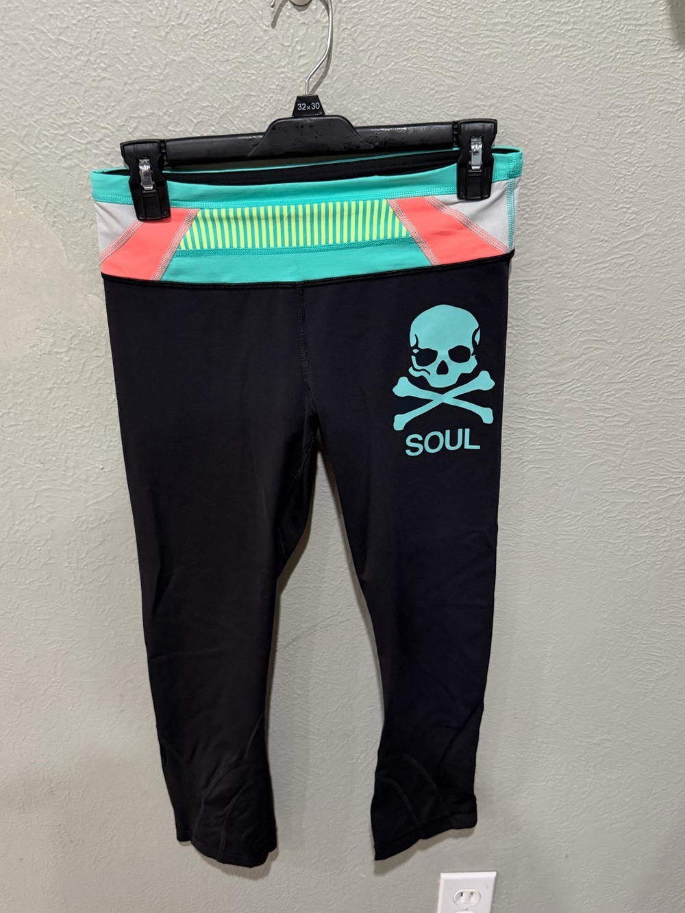 lululemon athletica Black Capri Leggings with Aqua Skull and Coral Waist Panels